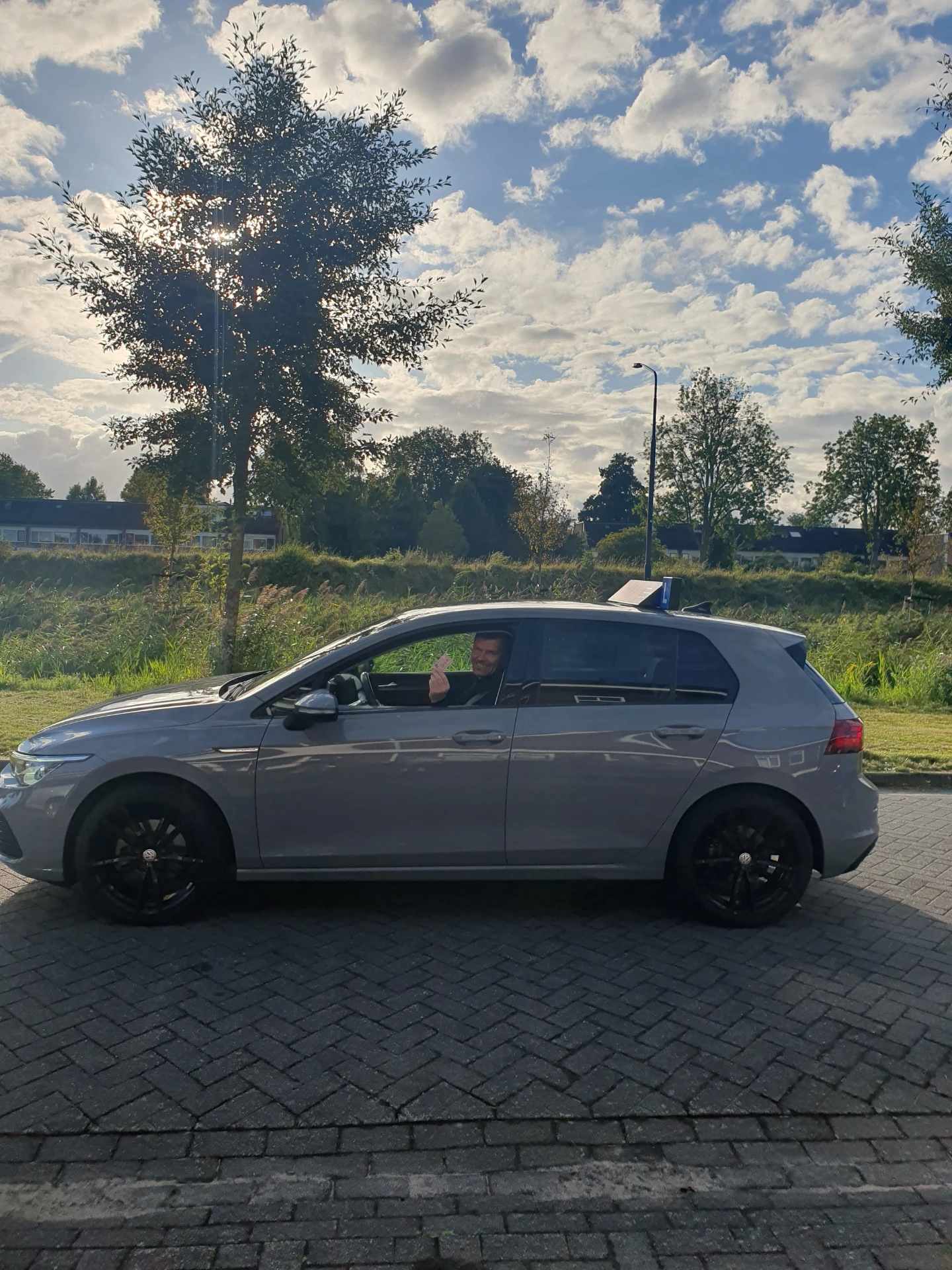Geslaagde leerling in de lesauto van GOAT on the Road